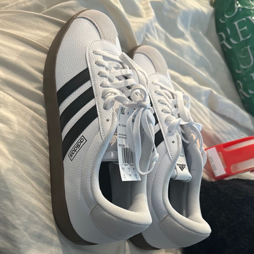 Adidas White Sneakers with Black Stripes and Brown Sole